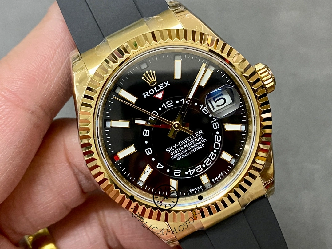 Handheld angled view of the Rolex Sky-Dweller m336238 0002 showing fluted bezel and markers.