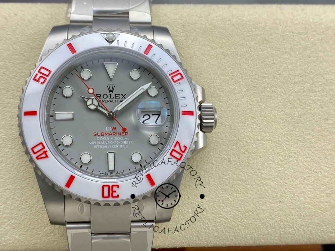 Rolex DIW Submariner Date 116610 on cushion, front view showing grey dial and red bezel accents.