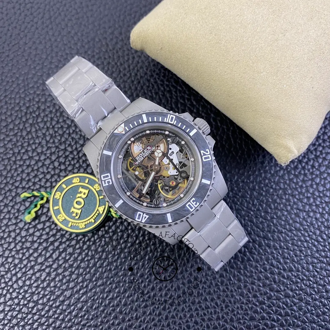 Rolex Submariner 114060, close view with hang tag showing skeleton dial texture.