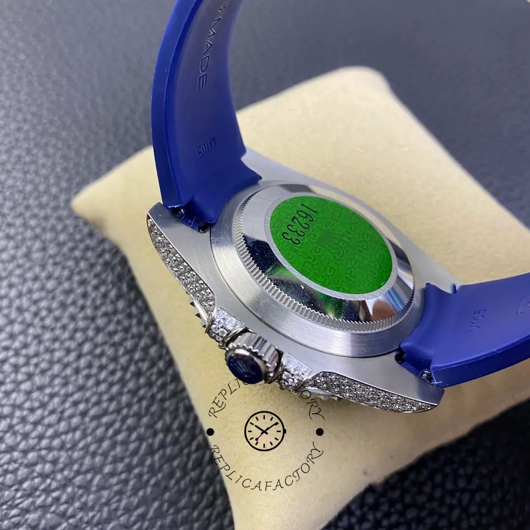 Strap side view of Rolex Submariner 116610 showing inner strap, caseback edge, and green tag sticker.