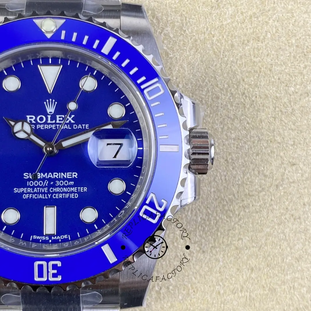 Rolex Submariner 116619LB, dial close-up showing blue bezel markings and hands.