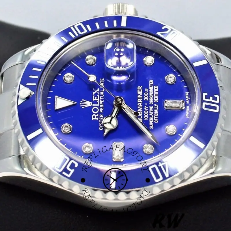 Dial close-up of Rolex Submariner 16610 with blue diamond markers and date magnifier.