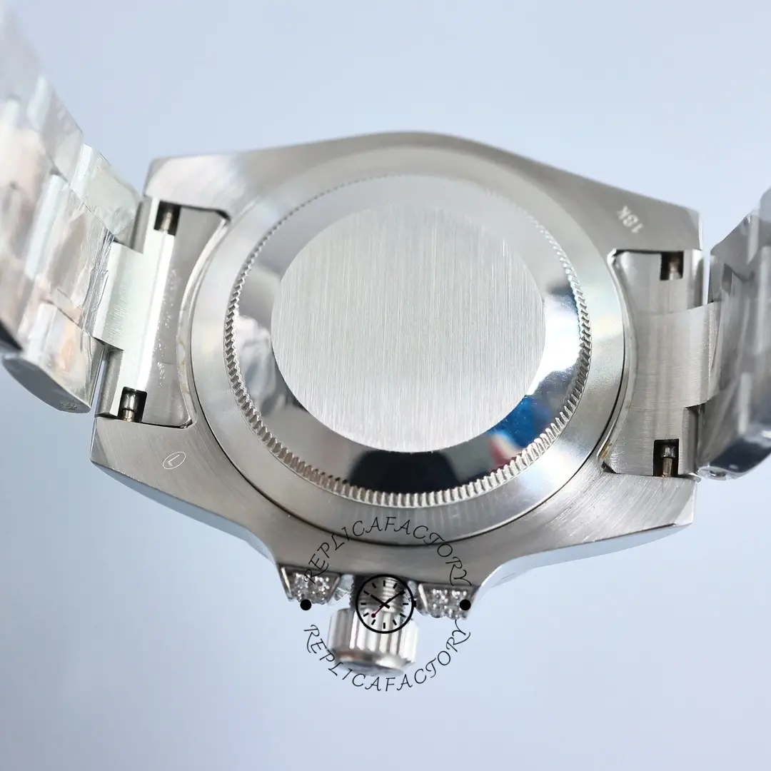 Rolex Submariner 116610LN, rear case and clasp view, diamond bracelet visible.