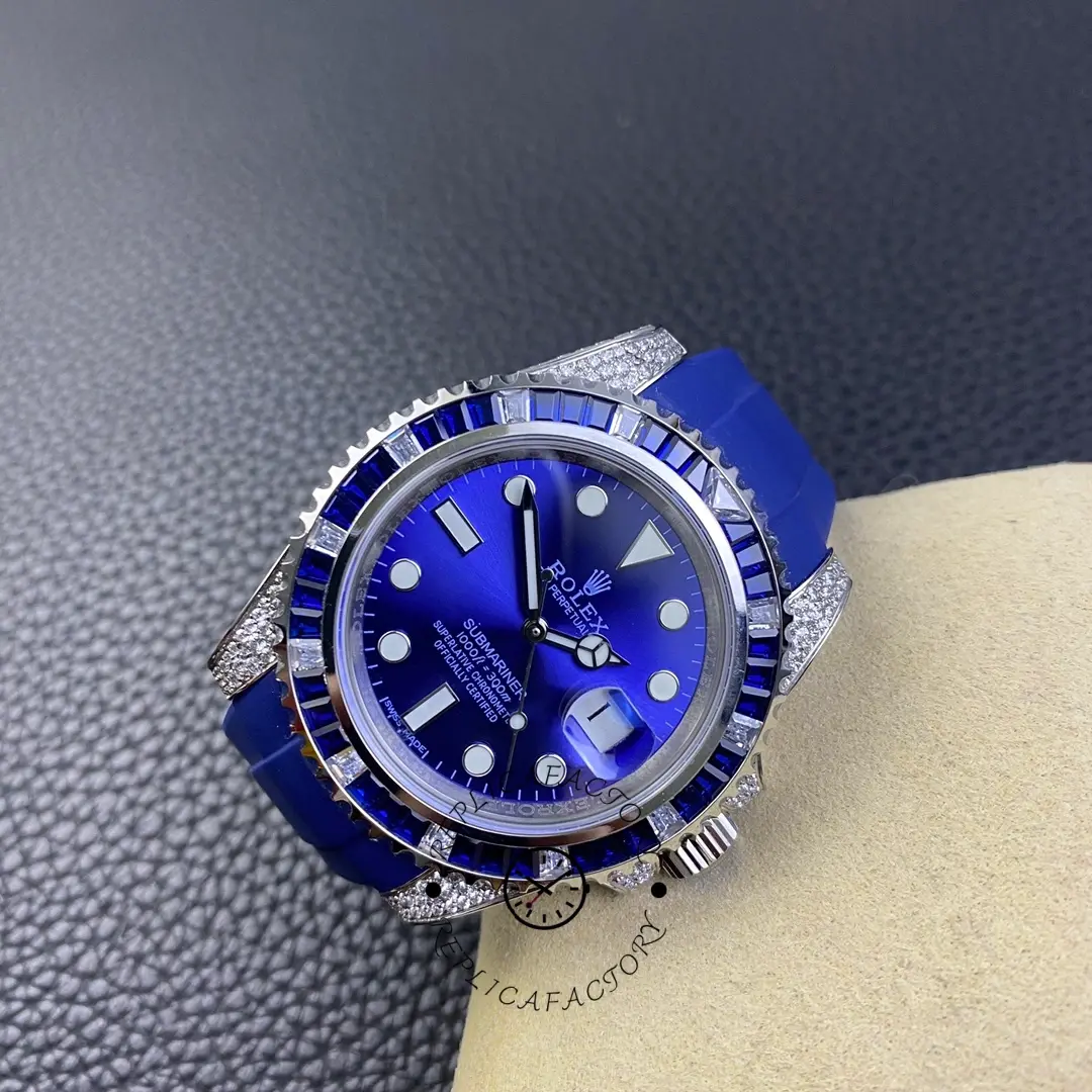 Front view on pillow of Rolex Submariner 116610 showing blue dial, blue bezel, and diamond-set case.