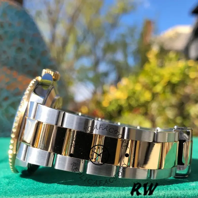 Rolex Submariner Date 16613, two-tone Oyster bracelet close-up showing links and clasp section.