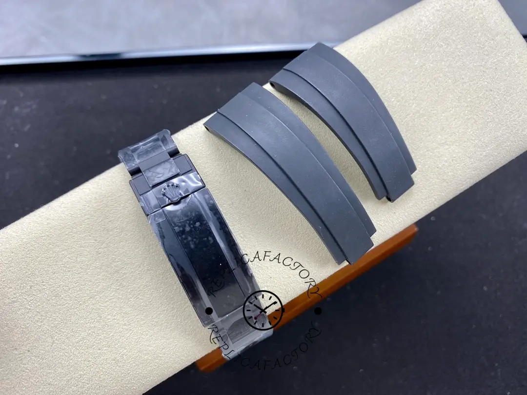 Bracelet/strap tail view of Rolex Submariner DIW 116610 showing strap end and clasp section on cushion.