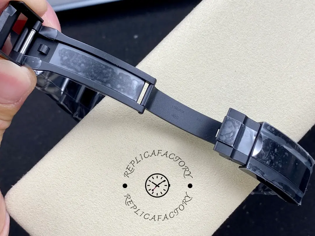 Strap clasp view of Rolex Submariner DIW 116610 showing black strap clasp and adjustment holes.