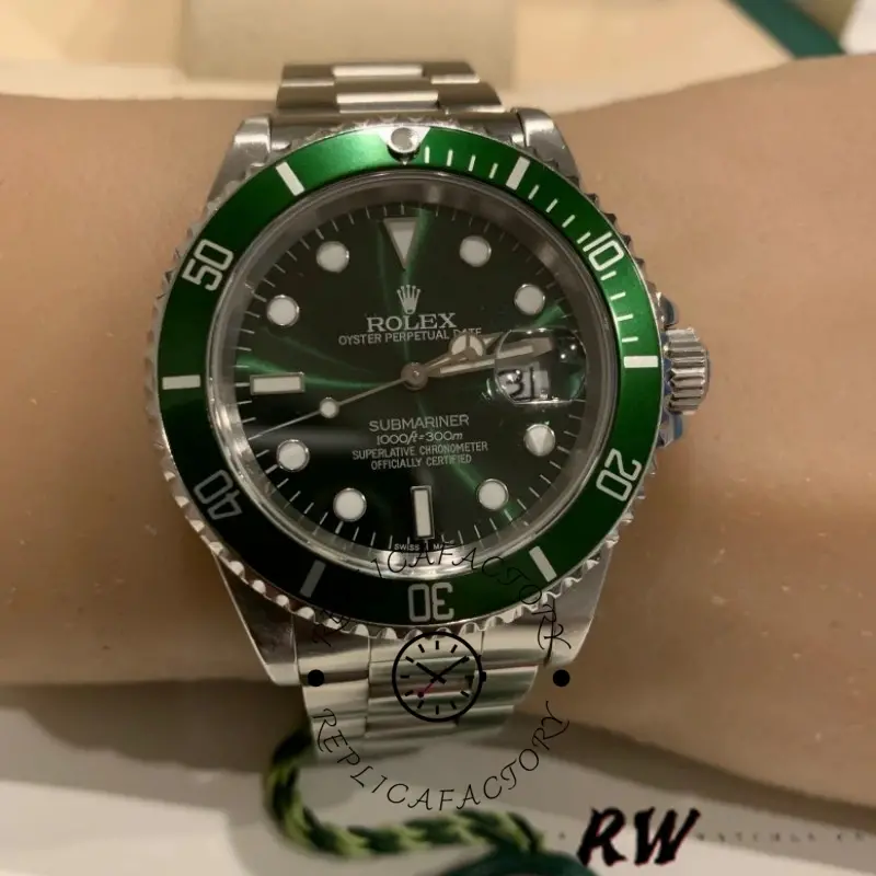 Rolex Submariner 16610, wrist shot showing green dial and bezel.