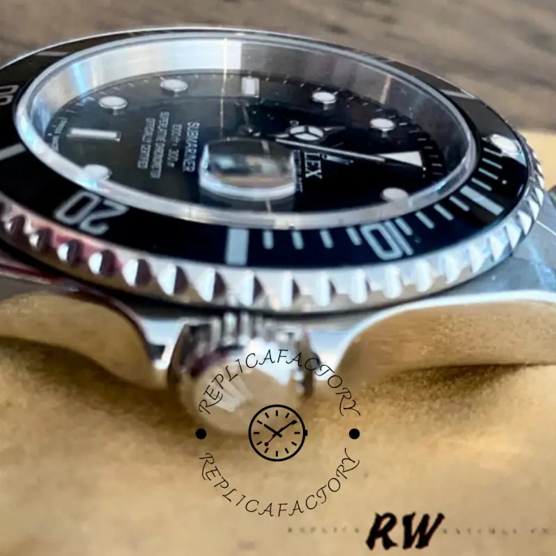 Rolex Submariner 16610 side bezel close-up, showing coin-edge grip and bezel insert.