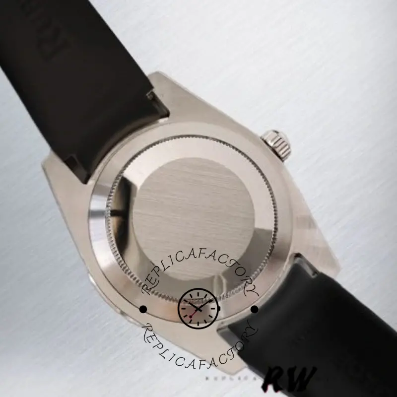 Rolex Submariner 116610, caseback view with black rubber strap attached.