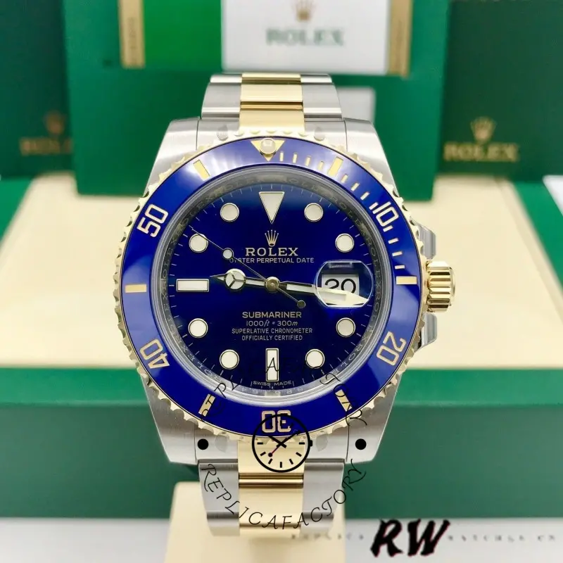 Rolex Submariner Date 16613 on display stand, blue dial, two-tone bracelet, Rolex box background.