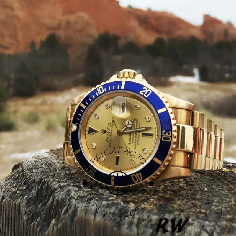 Rolex Submariner 16618, angled wrist-style display on outdoor rocks, champagne dial and blue bezel.