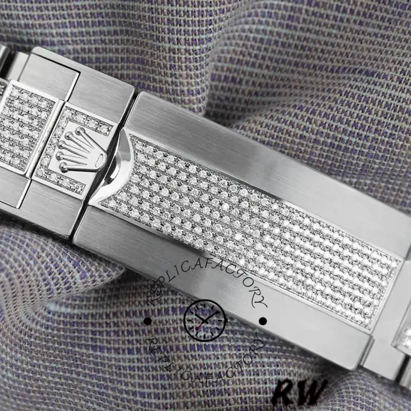 Rolex Submariner 116610LN clasp close-up, engraved Rolex crown on steel folding buckle.