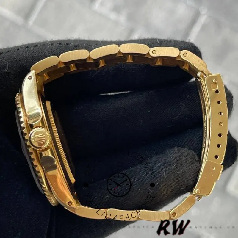 Rolex Submariner 16618, yellow gold crown detail, close-up view.