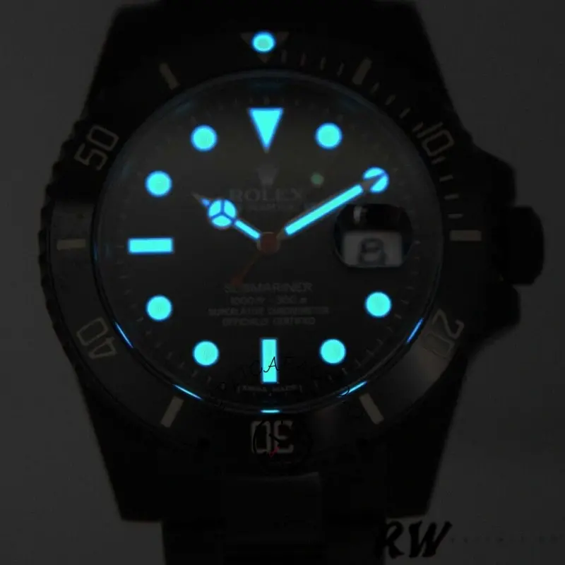 Rolex Submariner 116610, lume shot showing glowing hour markers and hands.
