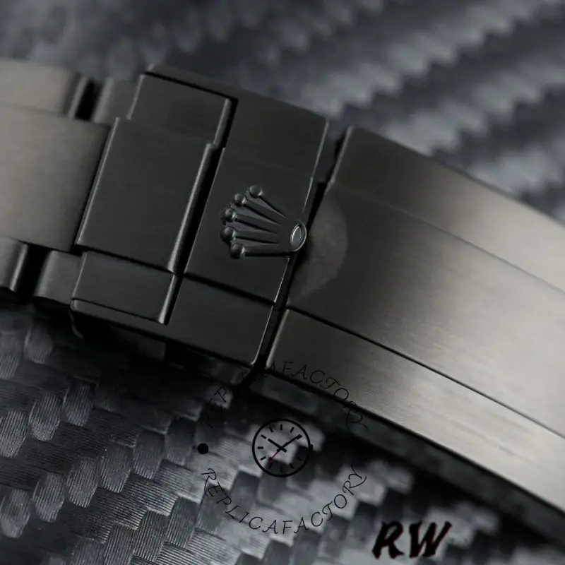 Rolex Submariner Date 116610LN clasp close-up, engraved Rolex crown on black PVD/DLC folding buckle.