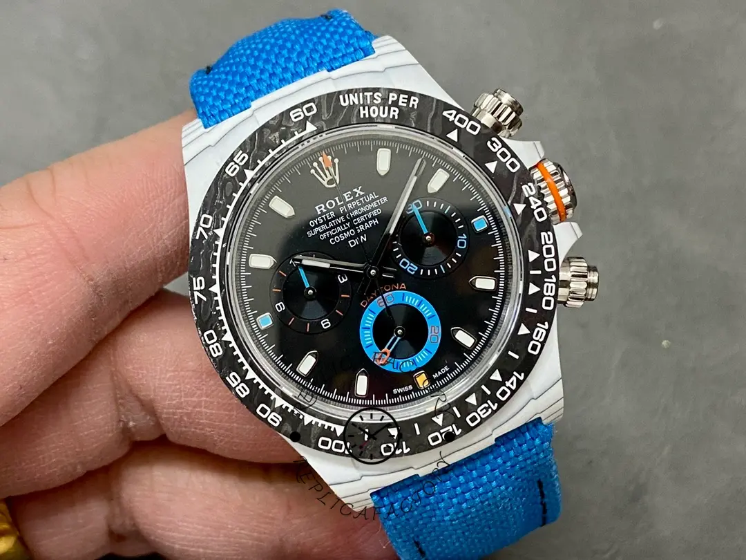 Rolex Daytona 116500LN, angled front view showing bezel and dial texture with blue strap.