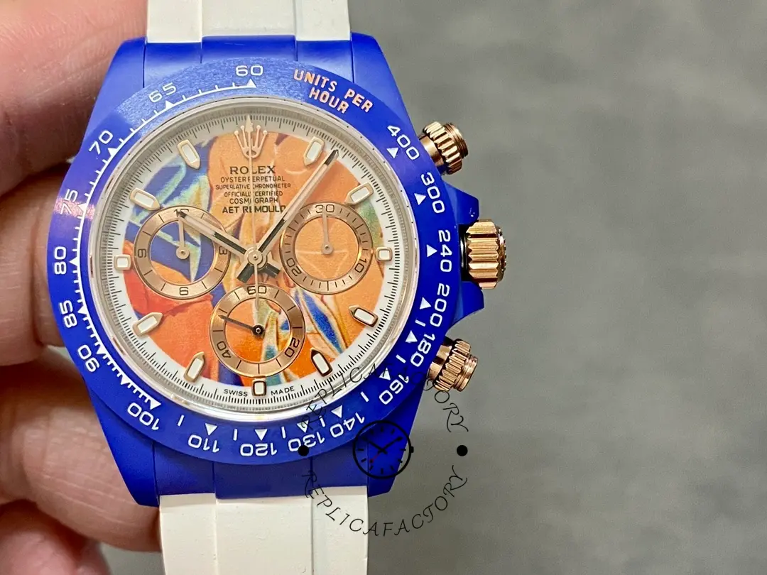 Rolex Daytona AET Remould Les Demoiselles D'Avignon 40mm, front view showing orange dial details.