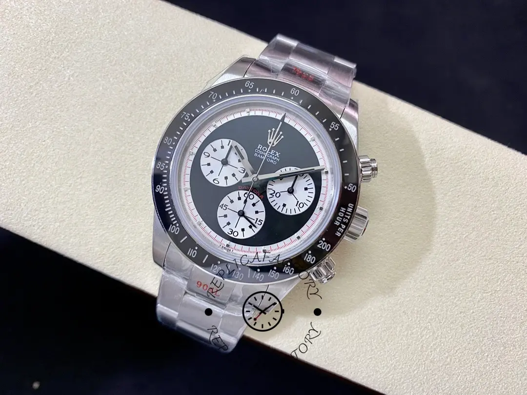 Rolex Daytona 116520 on a display pillow, full watch view with steel bracelet and black bezel.