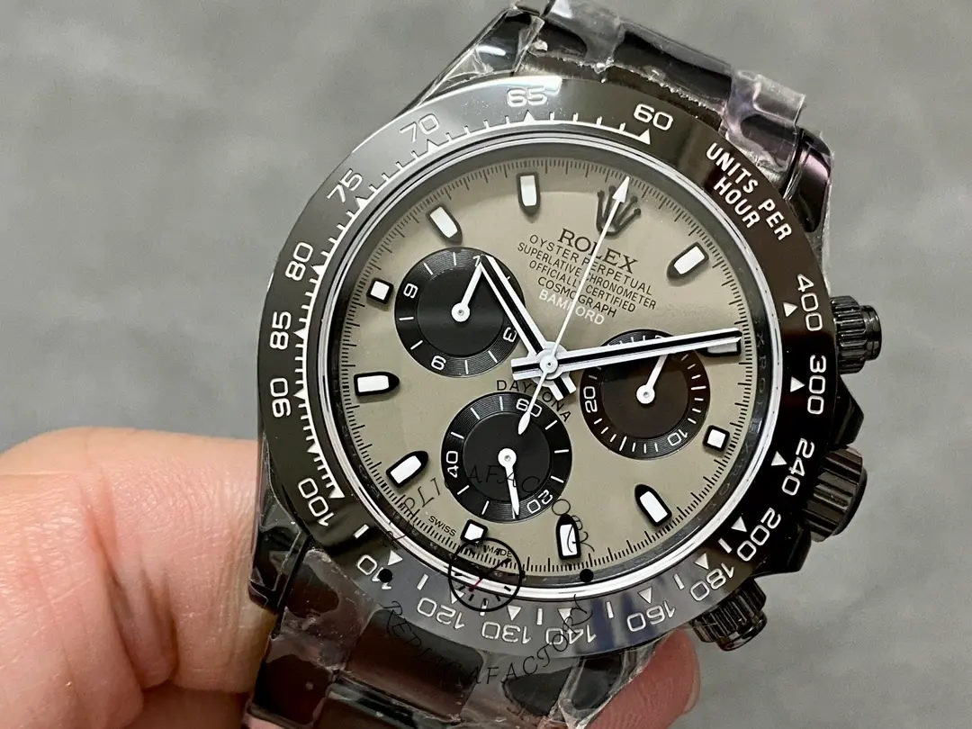 Angled close-up of the Rolex Daytona Blaken PVD 40MM, grey dial markers and subdials.