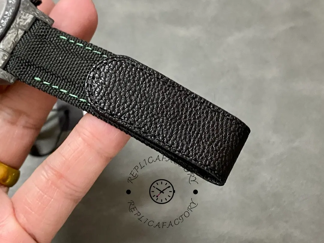 Rolex Daytona DIW 40mm, strap end close-up showing the buckle-side fabric and finish.