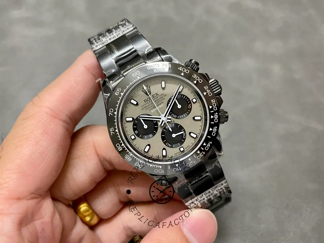 Hand-held full watch view of the Rolex Daytona Blaken PVD 40MM with black PVD bracelet.