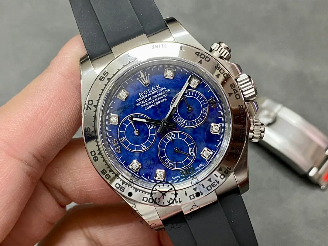 Angled close-up of the Rolex Daytona 116519, focusing on the blue garnet dial, subdials, and bezel stones.