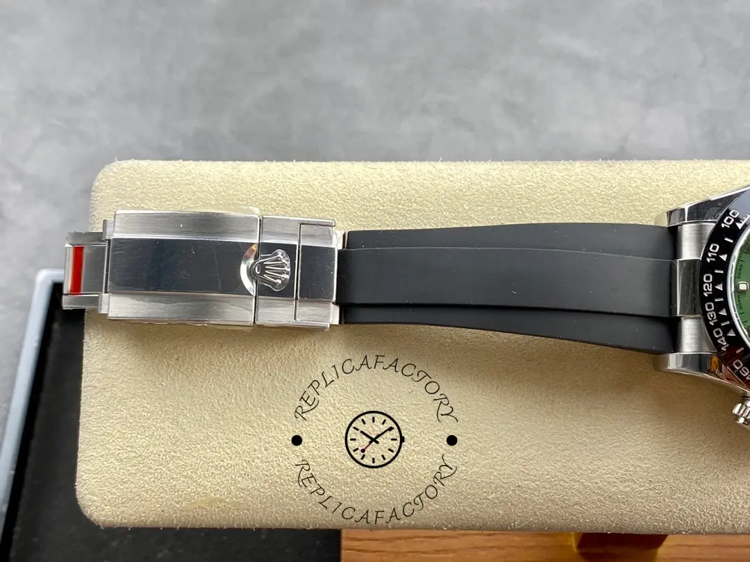 Rolex Daytona 126506, deployant clasp close-up on rubber strap, brushed clasp with Rolex crown.