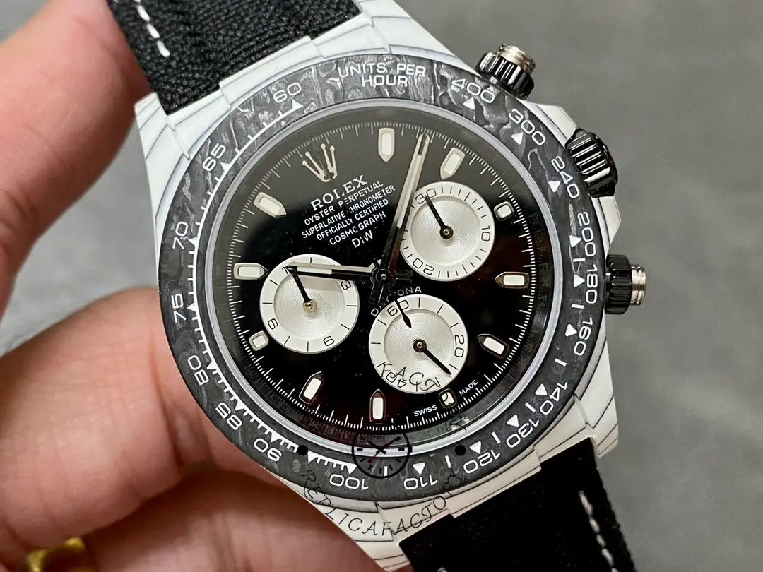 Close-up of Rolex Daytona Cosmograph 40mm dial, luminous hands and contrasting subdials in focus.