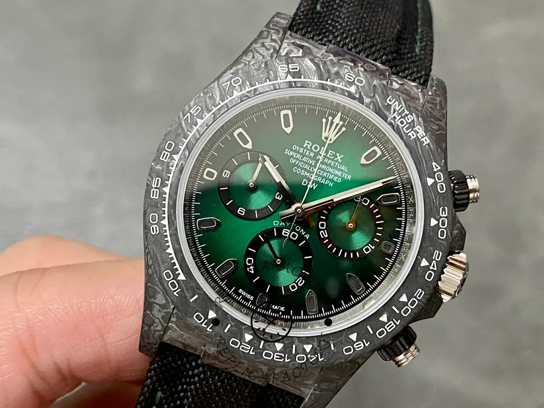 Rolex Daytona DIW 40mm, angled front view showing bezel edge and green dial texture.
