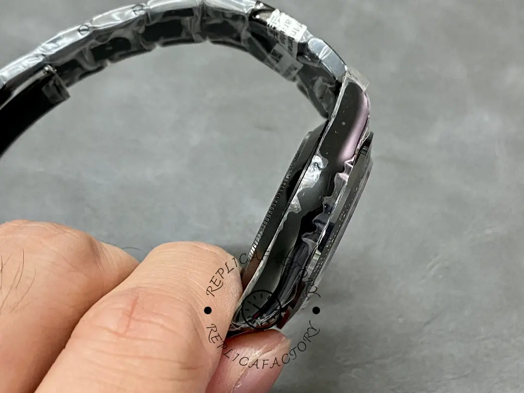 Side view of the Rolex Daytona Blaken PVD 40MM, showing bracelet curve and case profile.