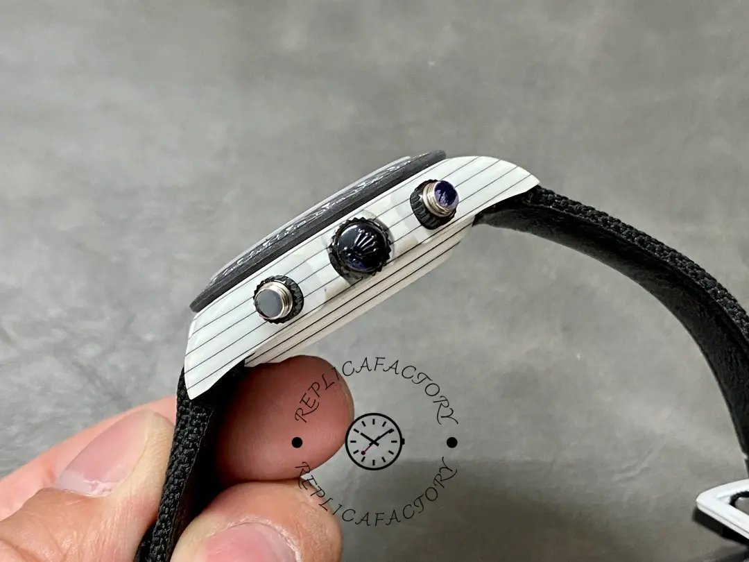 Side profile of Rolex Daytona Cosmograph 40mm showing crown guards and chronograph pushers.