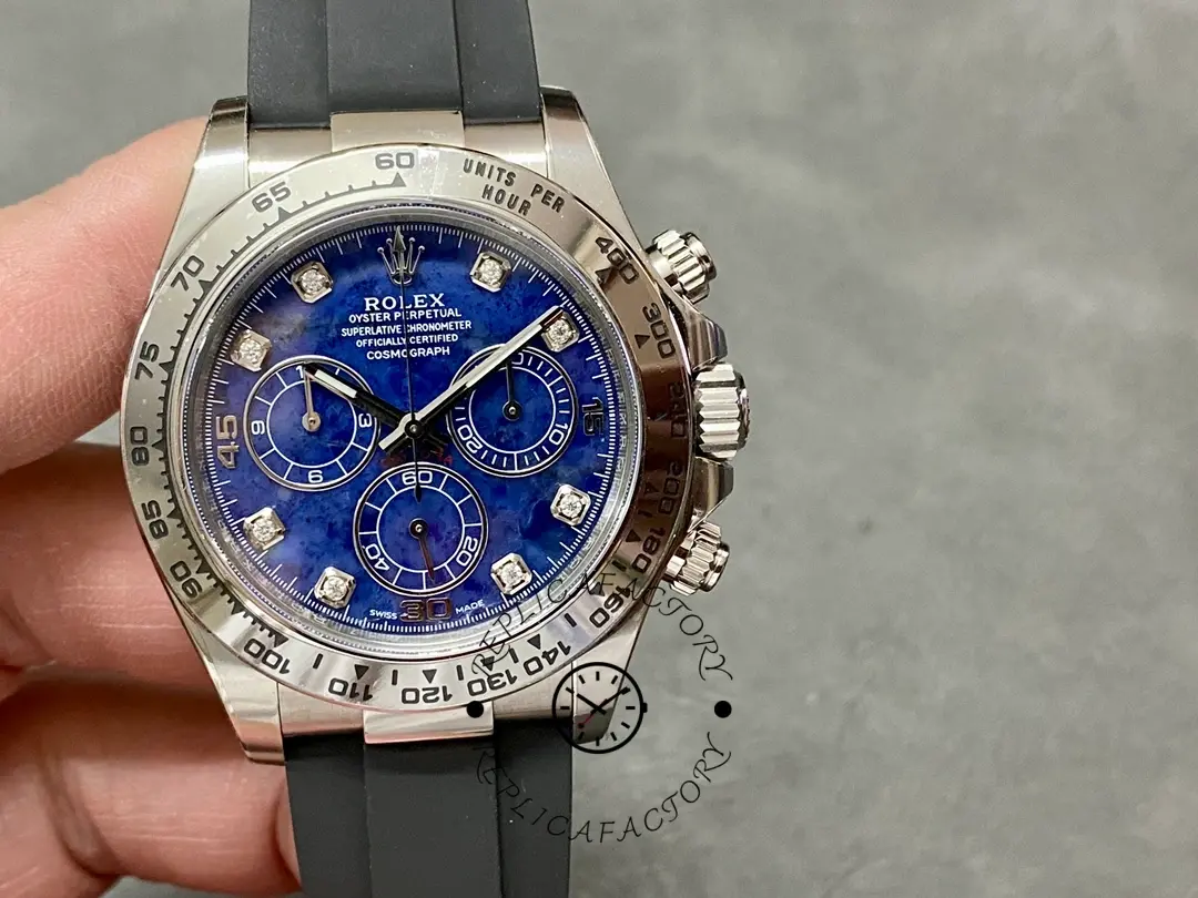 Handheld view of the Rolex Daytona 116519 showing the blue garnet dial and diamond hour markers.