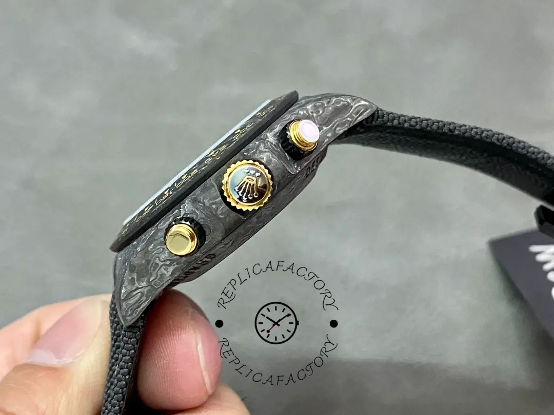 Rolex Daytona DIW 40mm, side view showing the crown and chronograph pushers on the case.