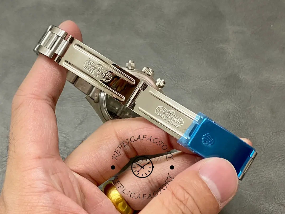 Rolex Daytona 6265, open clasp interior view showing the folding clasp mechanism with blue protective film.