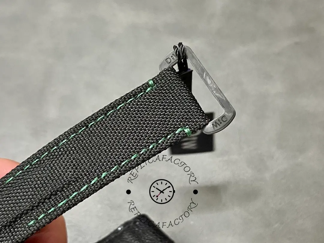 Rolex Daytona DIW 40mm, strap tip and attachment close-up showing connector hardware detail.