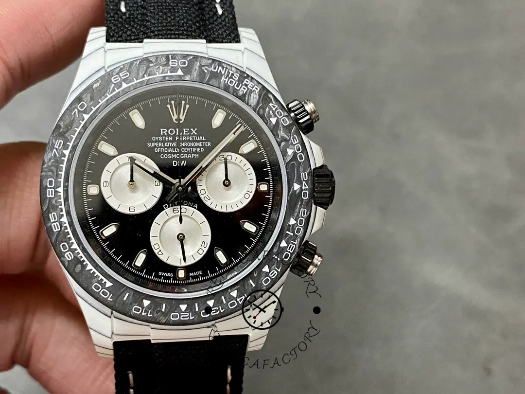 Full watch shot of Rolex Daytona Cosmograph 40mm on wrist, black bezel and panda subdials visible.