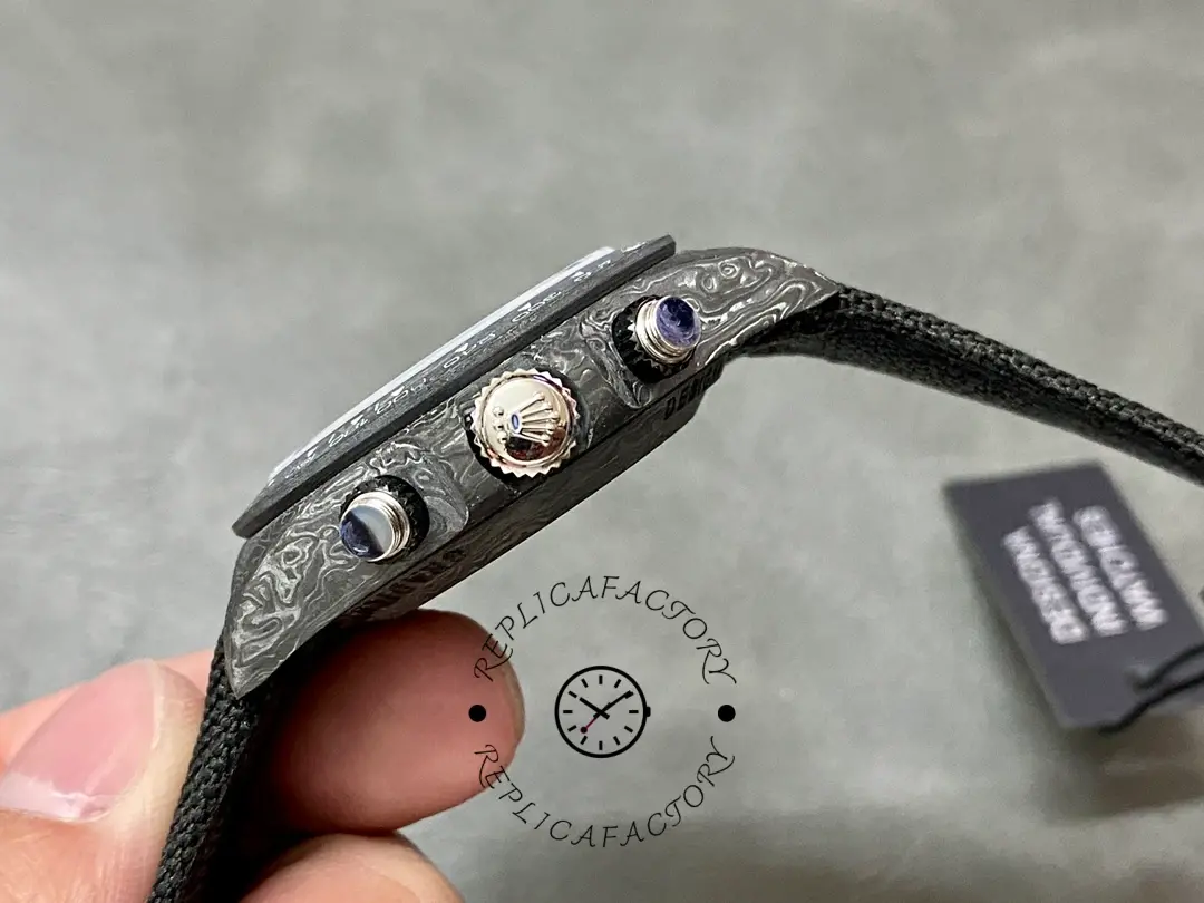 Rolex Daytona DIW 40mm, side profile showing crown and chronograph pushers in carbon-style case.