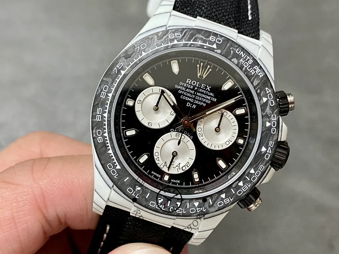 Angled full view of Rolex Daytona Cosmograph 40mm highlighting carbon-style case texture and bezel edge.