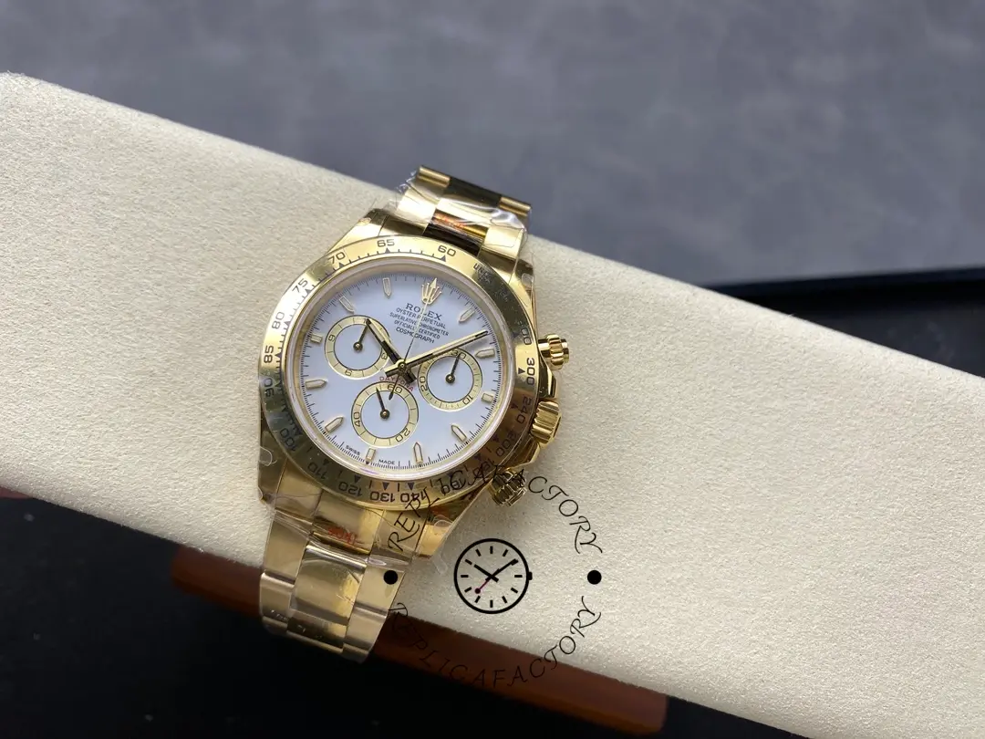 Full watch view of Rolex Daytona 126508-0001 on cushion showing gold bracelet and white dial.