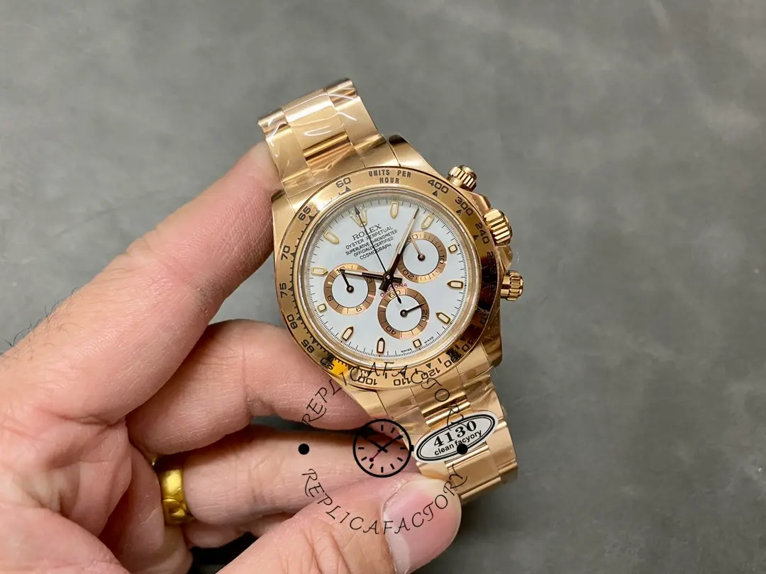 Rolex Daytona 126508, full watch in hand showing white dial and rose gold bracelet fit.