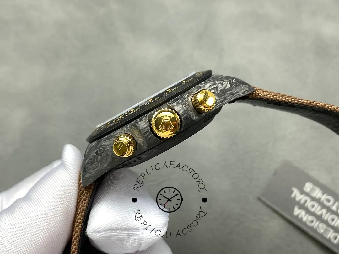 Side profile of Rolex Daytona DiW Black Gold highlighting gold crown and pushers.