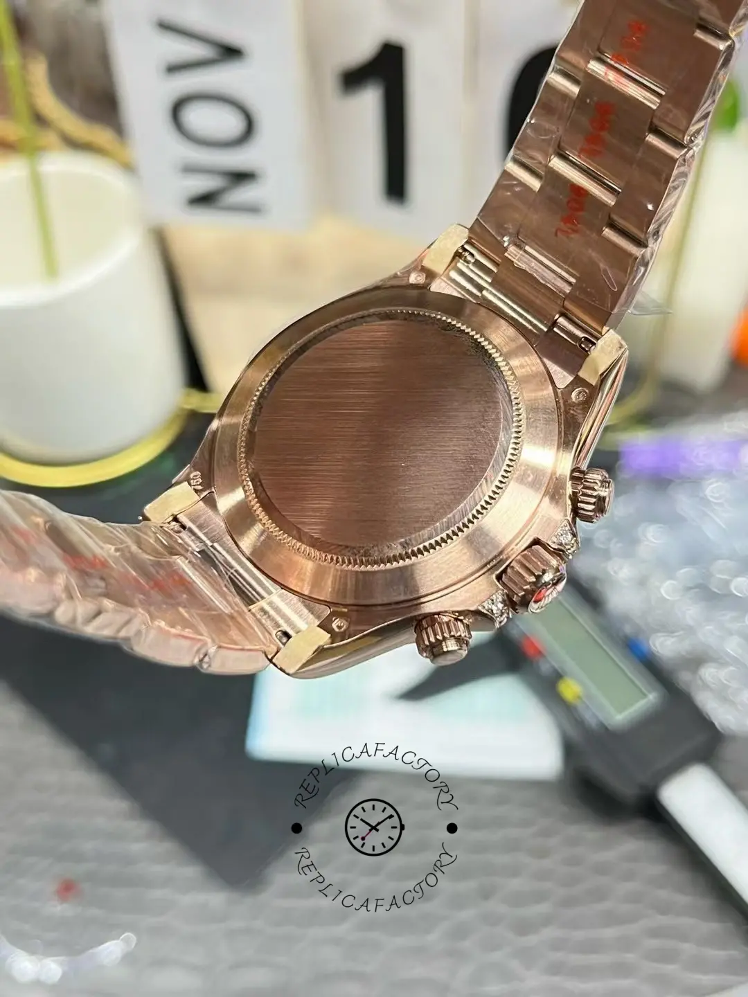 Rolex Daytona 116595RBOW case back view, rose gold back with protective film.