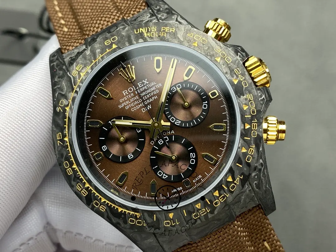 Angled front view of Rolex Daytona DiW Black Gold, carbon bezel with gold accents.