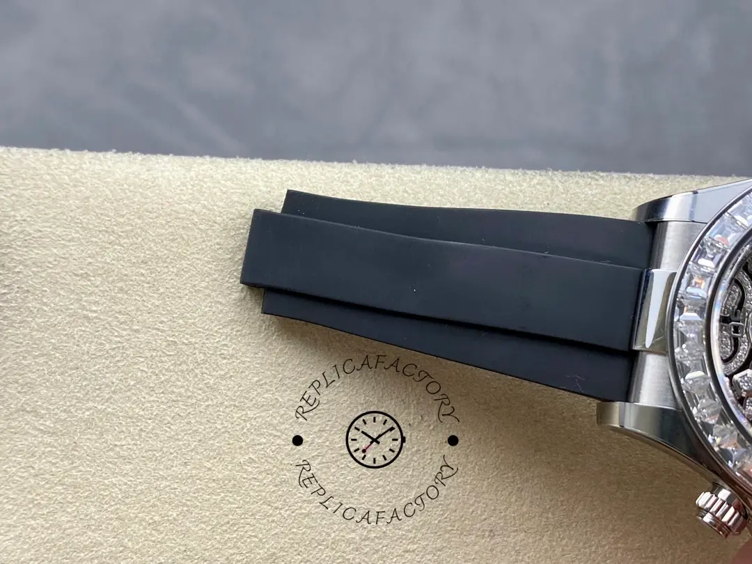 Rolex Daytona 116589TBR, close-up of Oysterflex strap end and keeper detail.