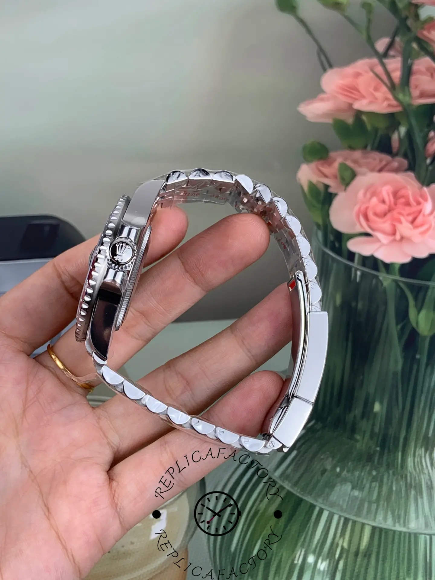 Side profile of Rolex GMT-Master II 126710BLRO showing case thickness, crown and bracelet curvature.