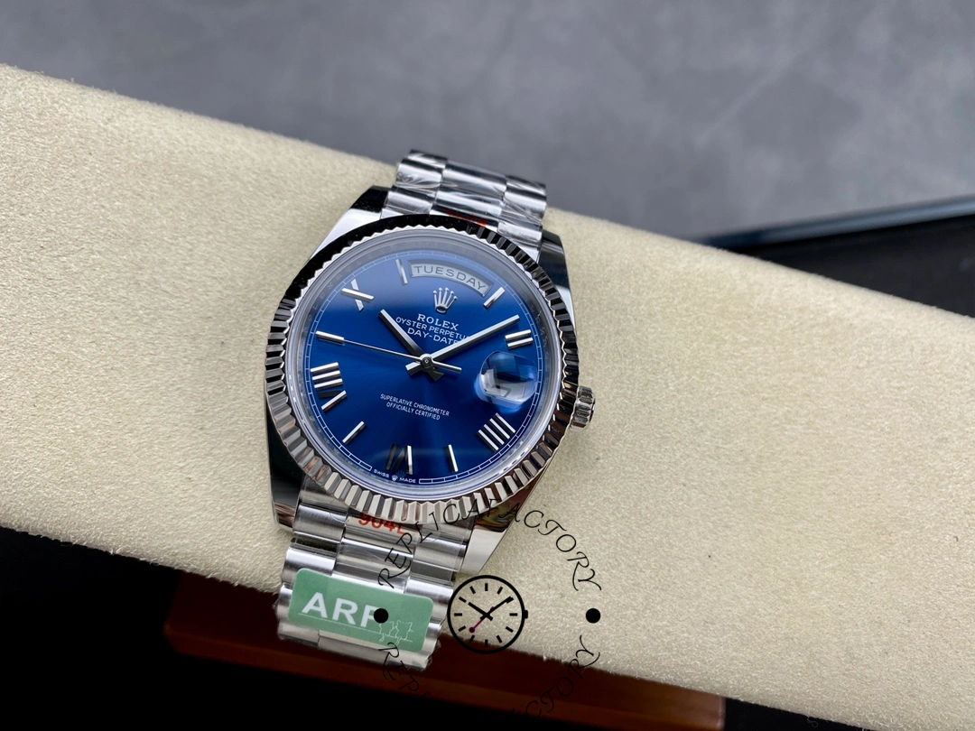 Full watch view of Rolex Day-Date 228239 on cushion showing blue dial and President bracelet.