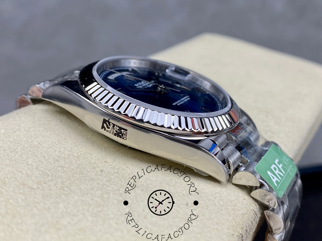 Side profile of Rolex Day-Date 228239 showing fluted bezel edge and polished case side on cushion.