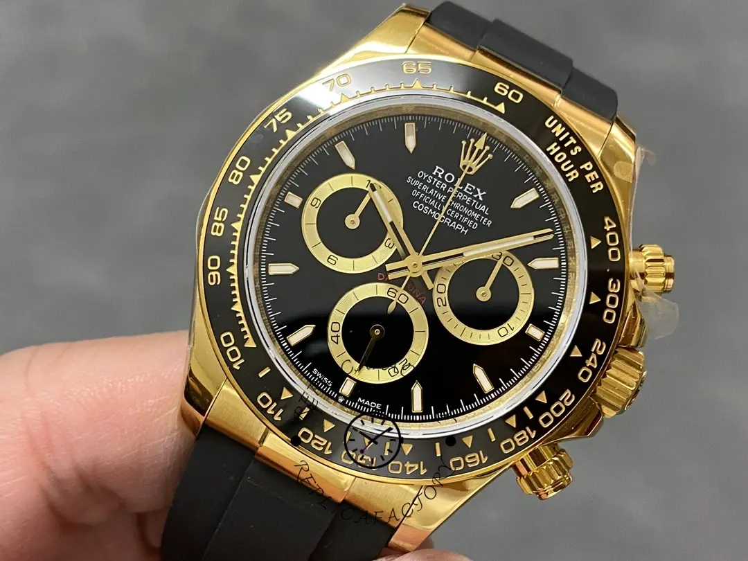 Rolex Daytona 126518LN handheld close-up, chronograph subdials and gold markers visible.