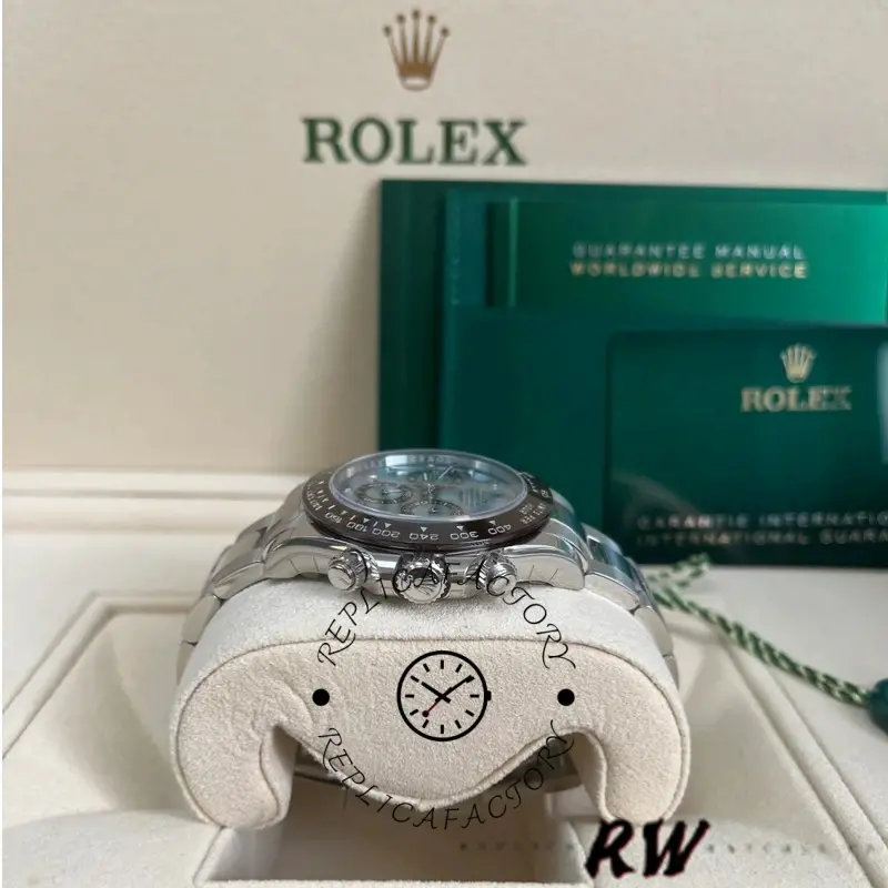 Full watch display of Rolex Daytona Arabic 116506 on stand with Rolex packaging behind.